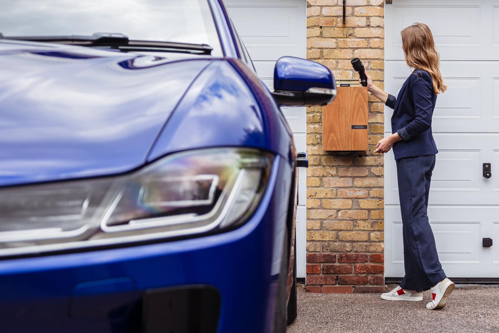 Level 2 EV charger mounted on a garage wall