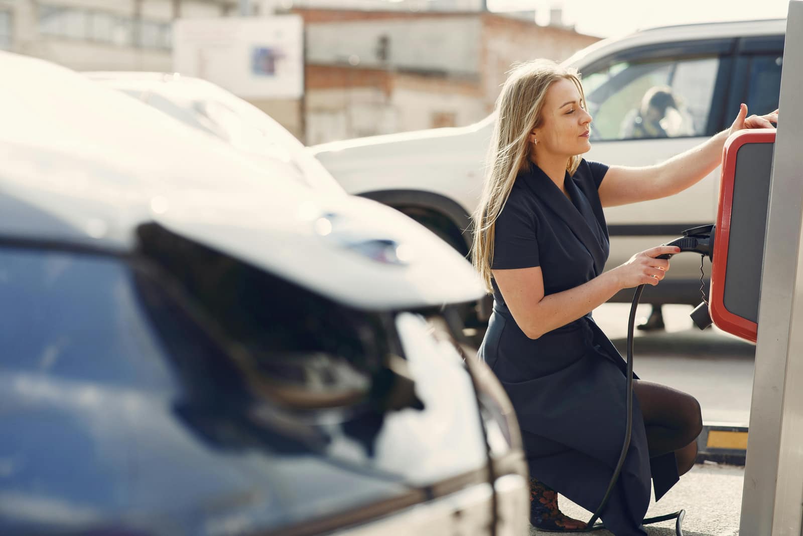 Comparison of EV charging port and gasoline pump
