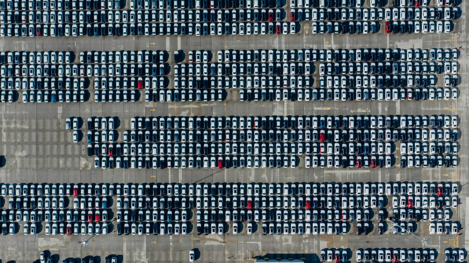 Japanese car auction hall with vehicles in bidding lanes